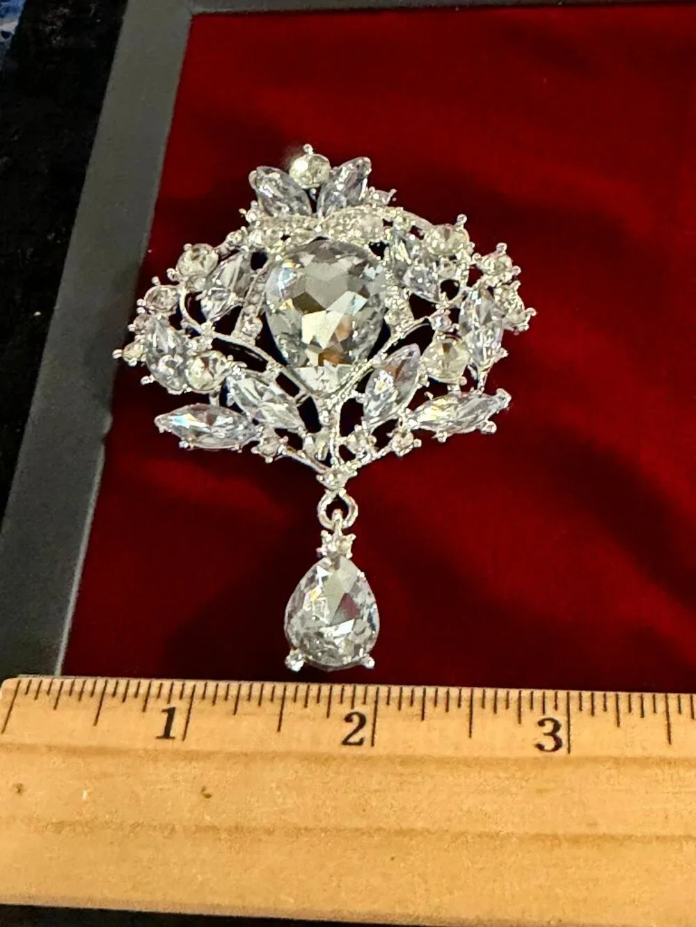 Silver-Tone Rhinestone Floral Brooch with Teardrop Dangle
